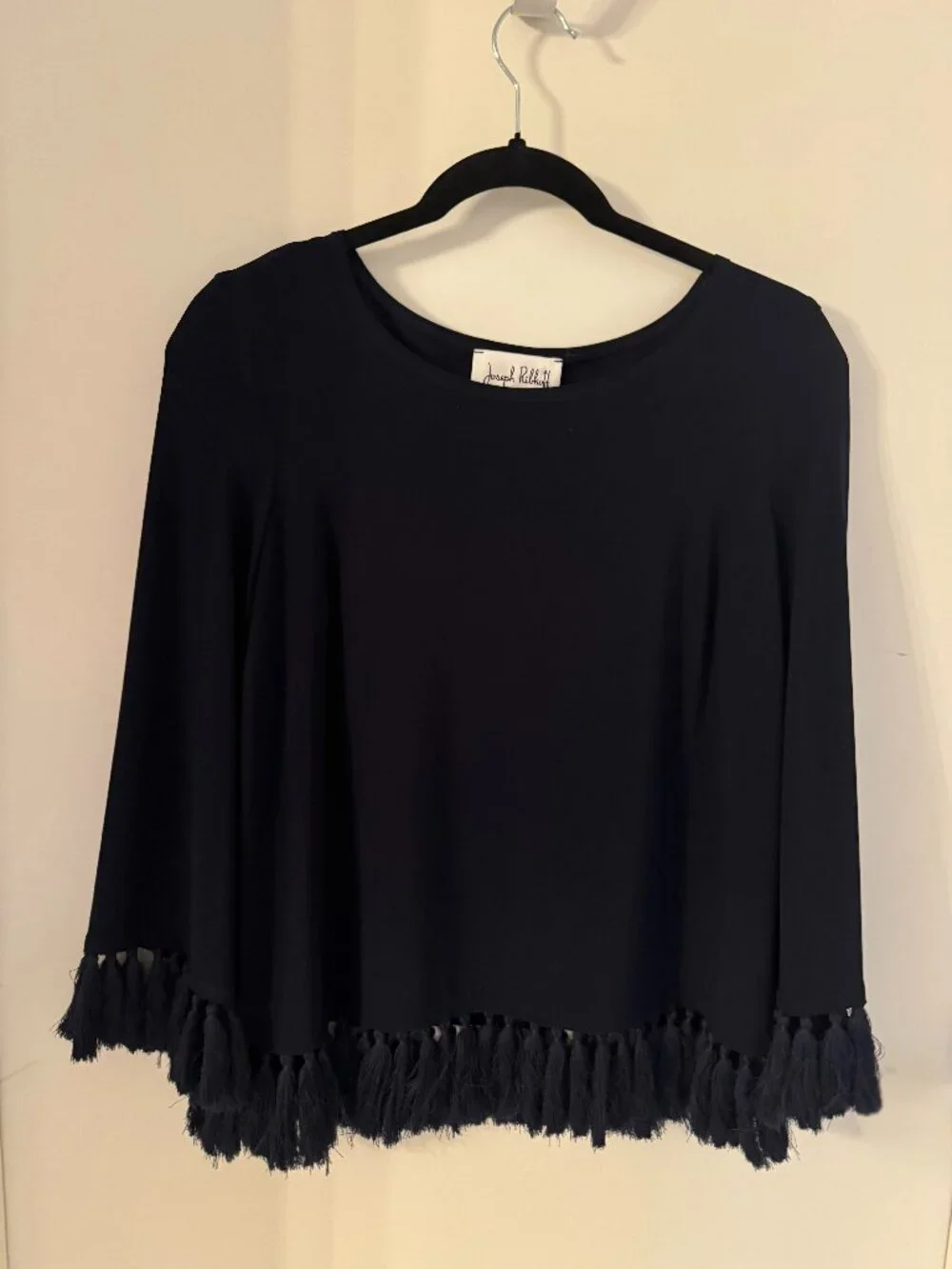 Joseph Ribkoff silky top size M with distinctive fringe along cuffs and hem